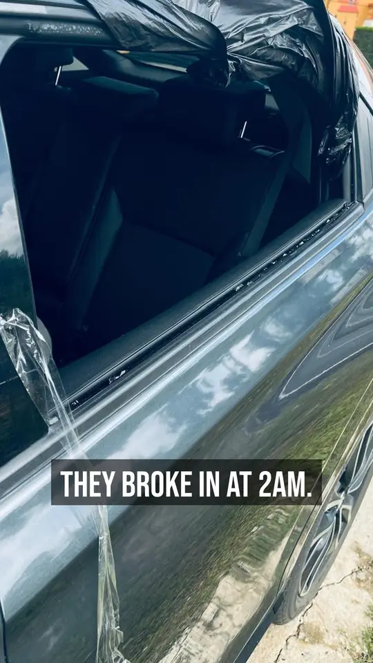 The vehicle's broken window after the 2am break-in